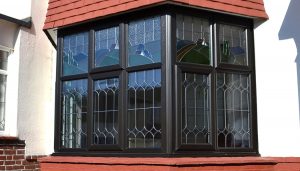 Black uPVC bay window and leaded glass