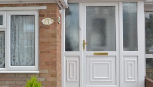 White uPVC entrance door with gold hardware