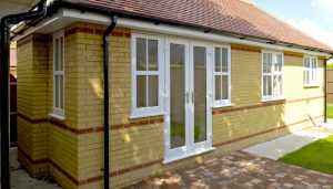 White uPVC french doors and side windows